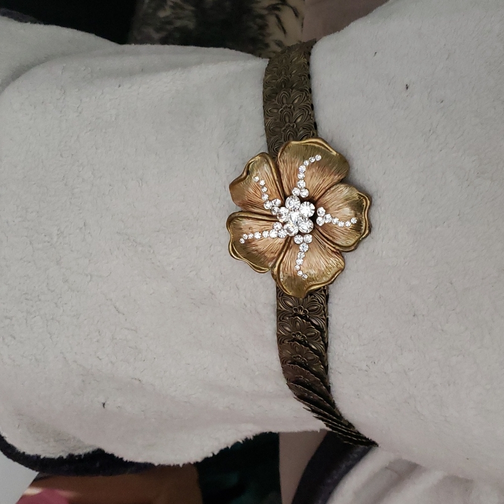 Rhinestone flower belt that has plenty of stretch.